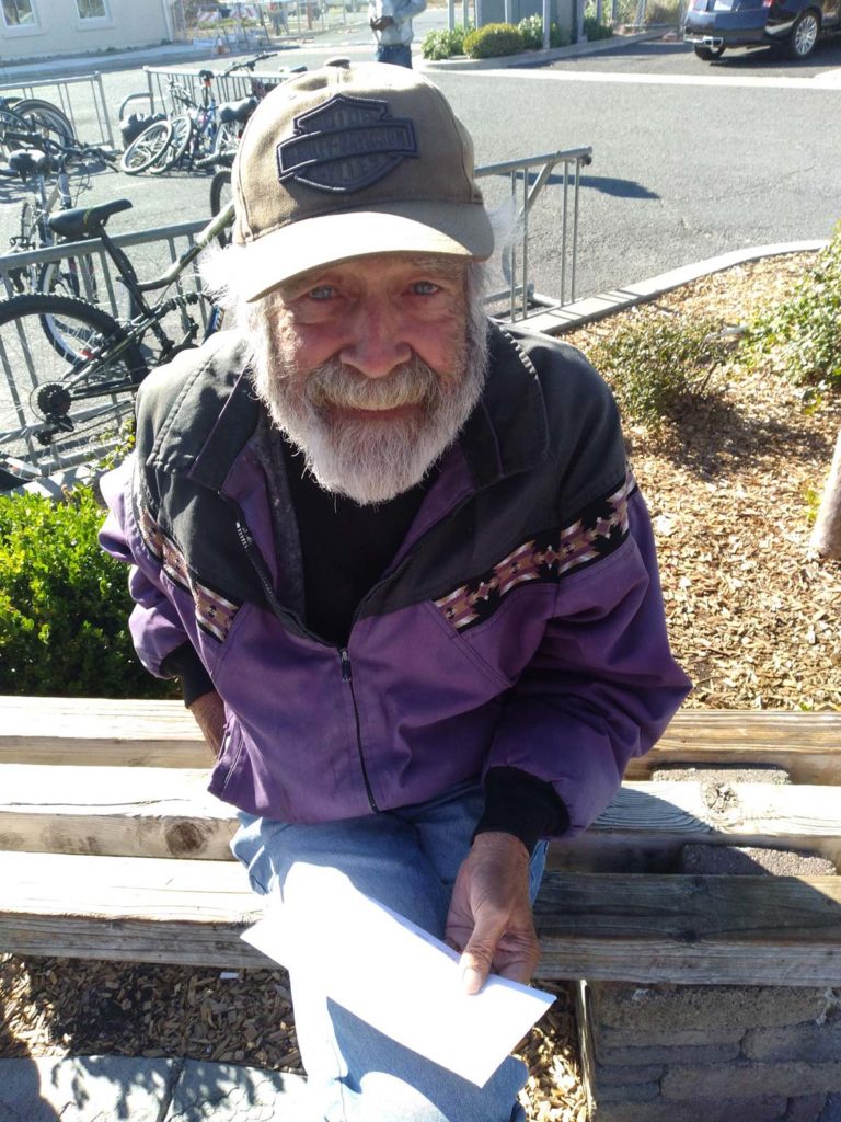 Robert sitting on a bench